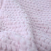 The close-up image reveals the delicate weave and plushness of the Hello Doggie Paris Dog Blanket in rosewater