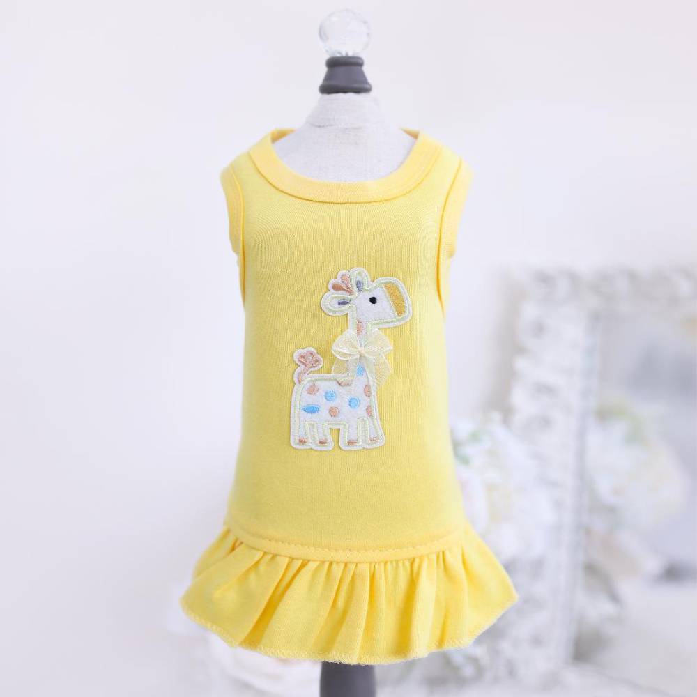 The front view of the yellow Hello Doggie Baby Safari Dog Dress features a whimsical embroidered giraffe, adding a charming touch to the outfit