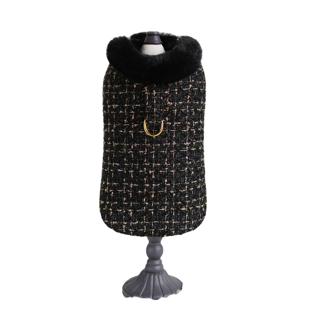 The full front view of the black tweed dog coat, with its detailed texture and gold ring, is referred to as the Hello Doggie Chantel Tweed Dog Coat