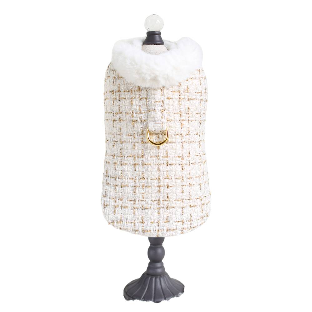 The full front view of the cream tweed dog coat, complete with a fur-trimmed collar and gold ring, is referred to as the Hello Doggie Chantel Tweed Dog Coat