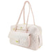 The image displays a blush pink quilted handbag with braided handles and a front pocket, known as the Hello Doggie Porsha Dog Carrier
