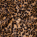 The image displays a detailed view of the Hello Doggie Cashmere Dog Blanket with a leopard print pattern, emphasizing its plush and cozy material