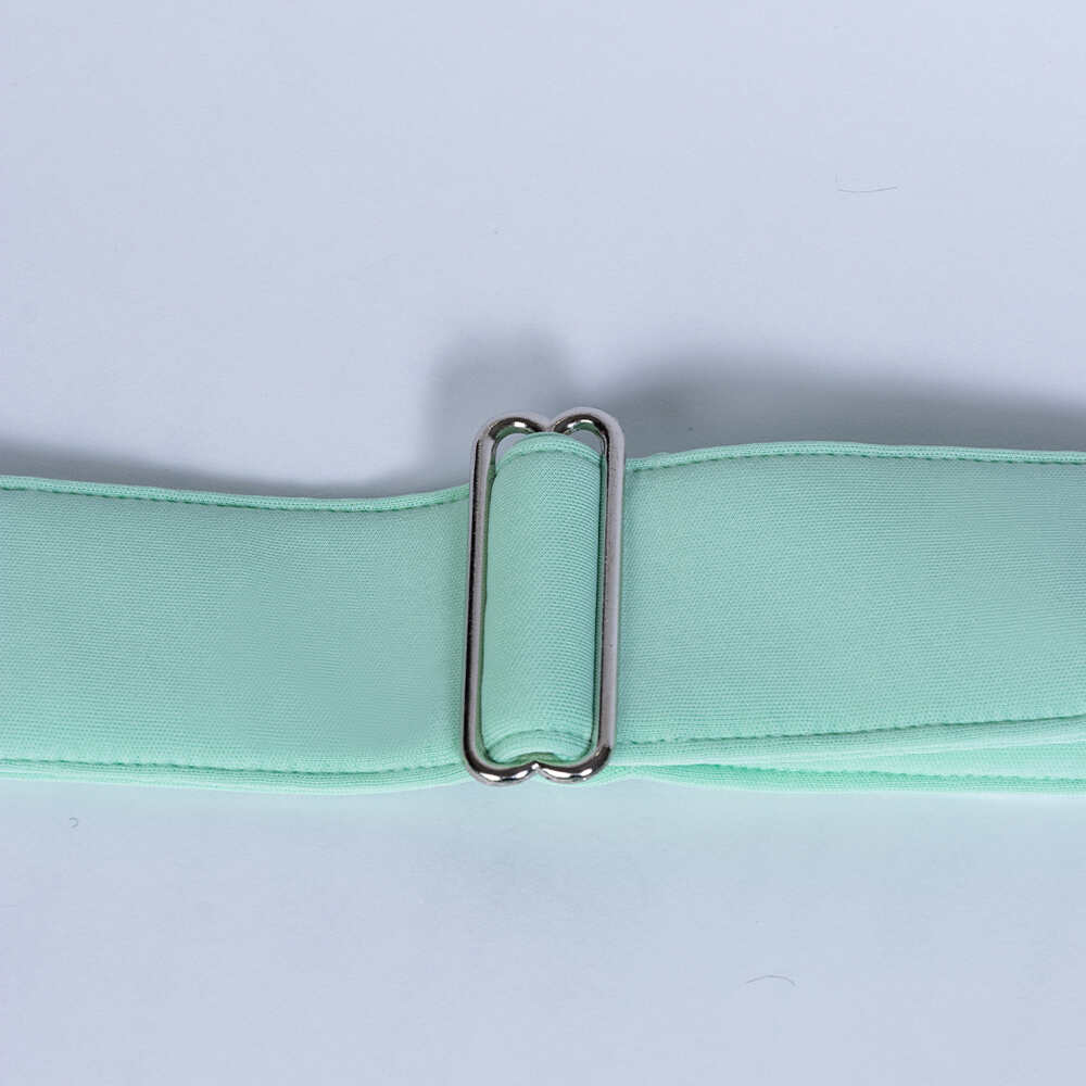 The image displays the adjustable strap of the Hello Doggie Signature Sling Dog Carrier in mint, offering a perfect fit