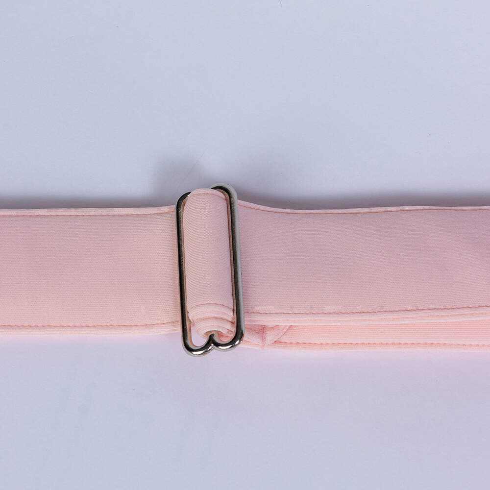 The image displays the adjustable strap of the Hello Doggie Signature Sling Dog Carrier in peach, offering a perfect fit