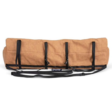 The image displays the underside and back view of the Paw PupProtector™ Faux Leather Memory Foam Dog Car Bed - Camel, showing its supportive straps