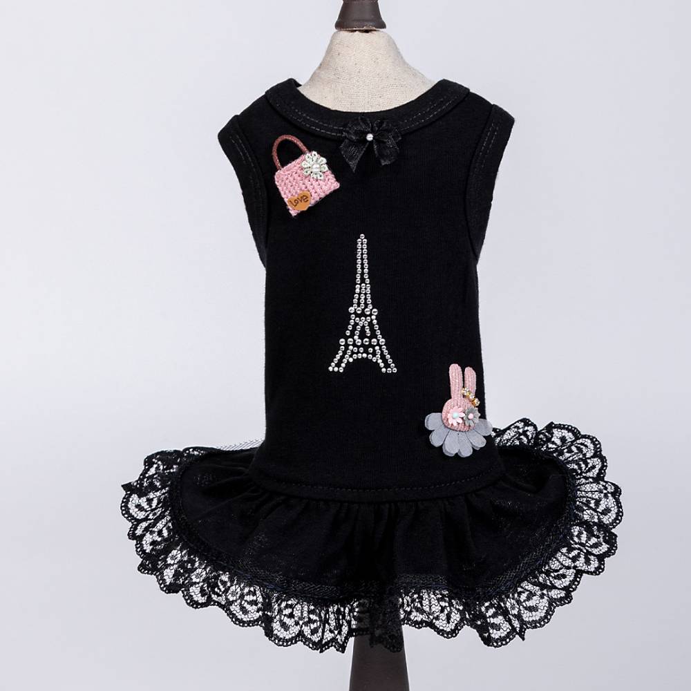 The image features a black Hello Doggie Paris Dog Dress displayed on a mannequin, highlighting the same Eiffel Tower design, pink handbag, and bunny applique
