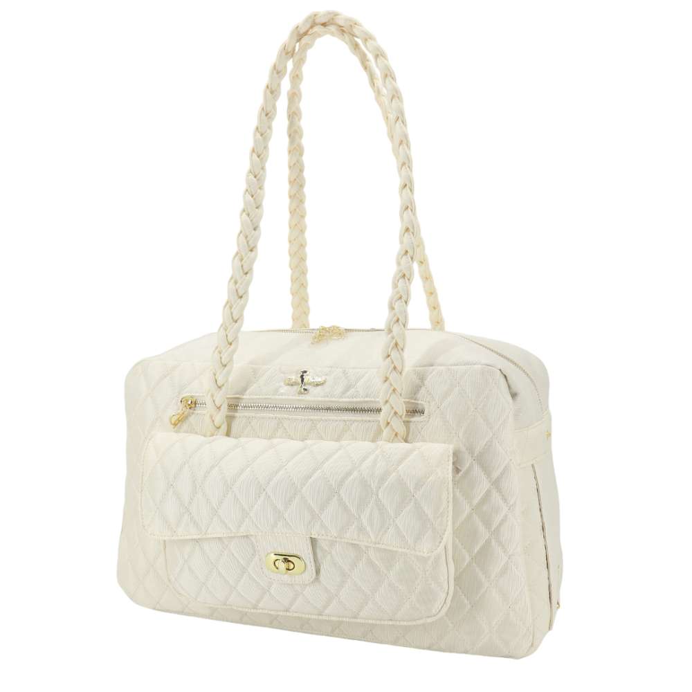 The image features a cream-colored quilted handbag with braided handles and a front pocket, labeled as the Hello Doggie Porsha Dog Carrier