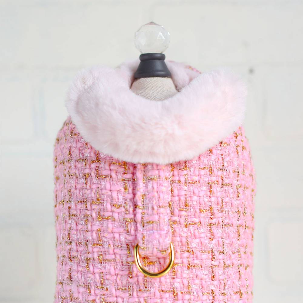 The image features a stylish bubblegum pink dog coat with a luxurious fur collar, described as the Hello Doggie Chantel Tweed Dog Coat