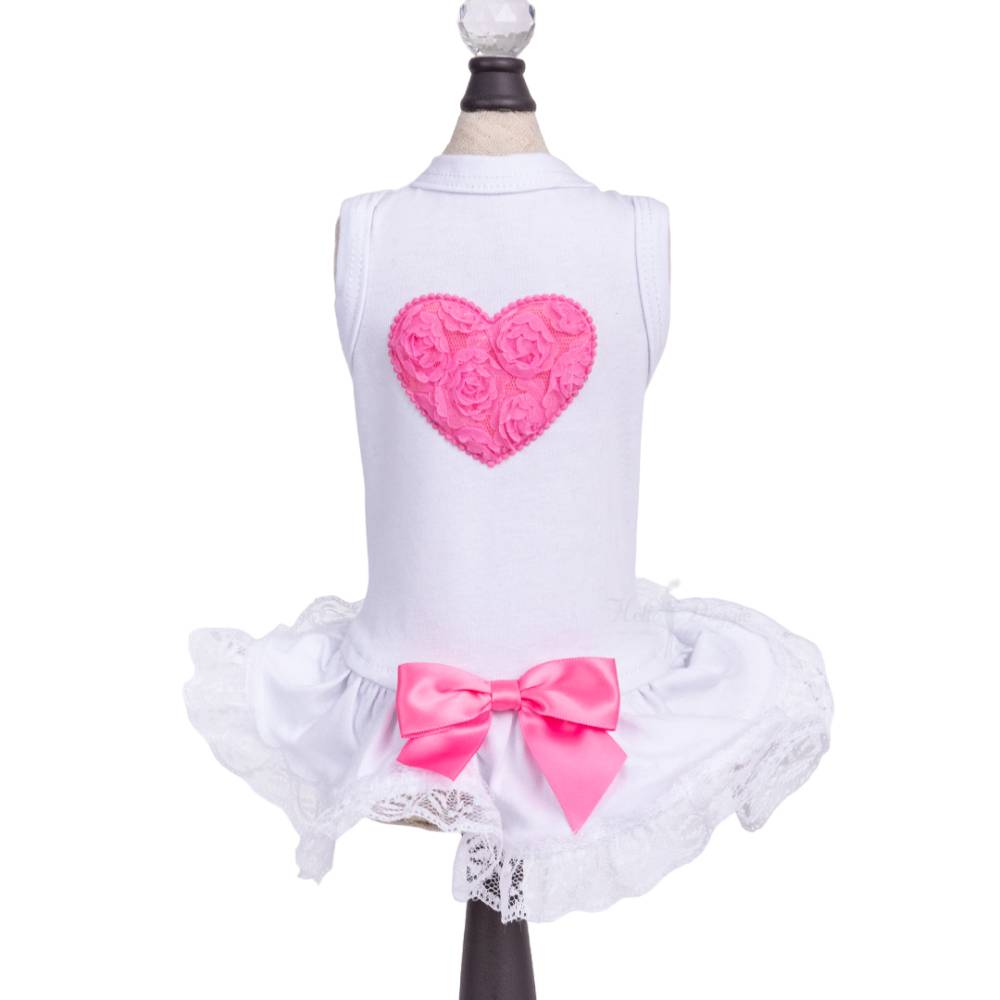 The image features a white Hello Doggie Lacey Puff Heart Dog Dress with a hot pink heart on the back and a hot pink bow on the skirt