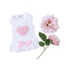 The image features the Hello Doggie Puff Heart Dog Dress in pink, laid flat next to pink flowers