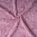The image is a close-up swatch of the Hello Doggie Cuddle Dog Blanket in mauve color, displaying the texture of the fabric