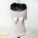 The image presents the Hello Doggie High Society Dog Sweater on a mannequin, showcasing its intricate cream knit design, fluffy black collar, and the white bow with a jeweled center
