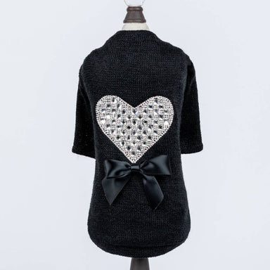 The image presents the Hello Doggie Oh My Heart Dog Sweater from a rear perspective, emphasizing the shimmering heart decoration and the satin bow