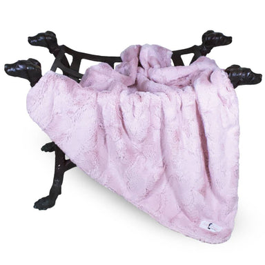 The image showcases a blush pink Hello Doggie Luxe Dog Blanket draped over a decorative dog-shaped stand