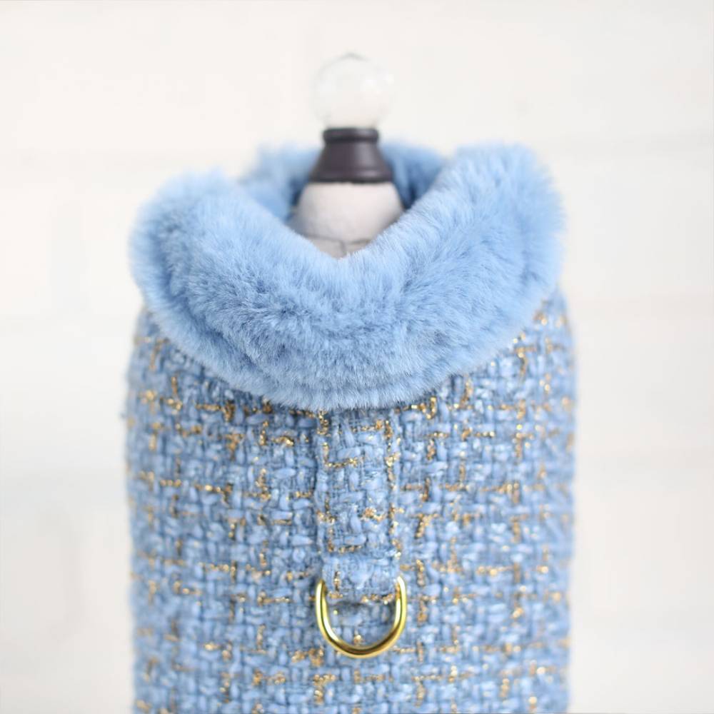 The image showcases a luxurious blue tweed dog coat with a plush fur collar, referred to as the Hello Doggie Chantel Tweed Dog Coat