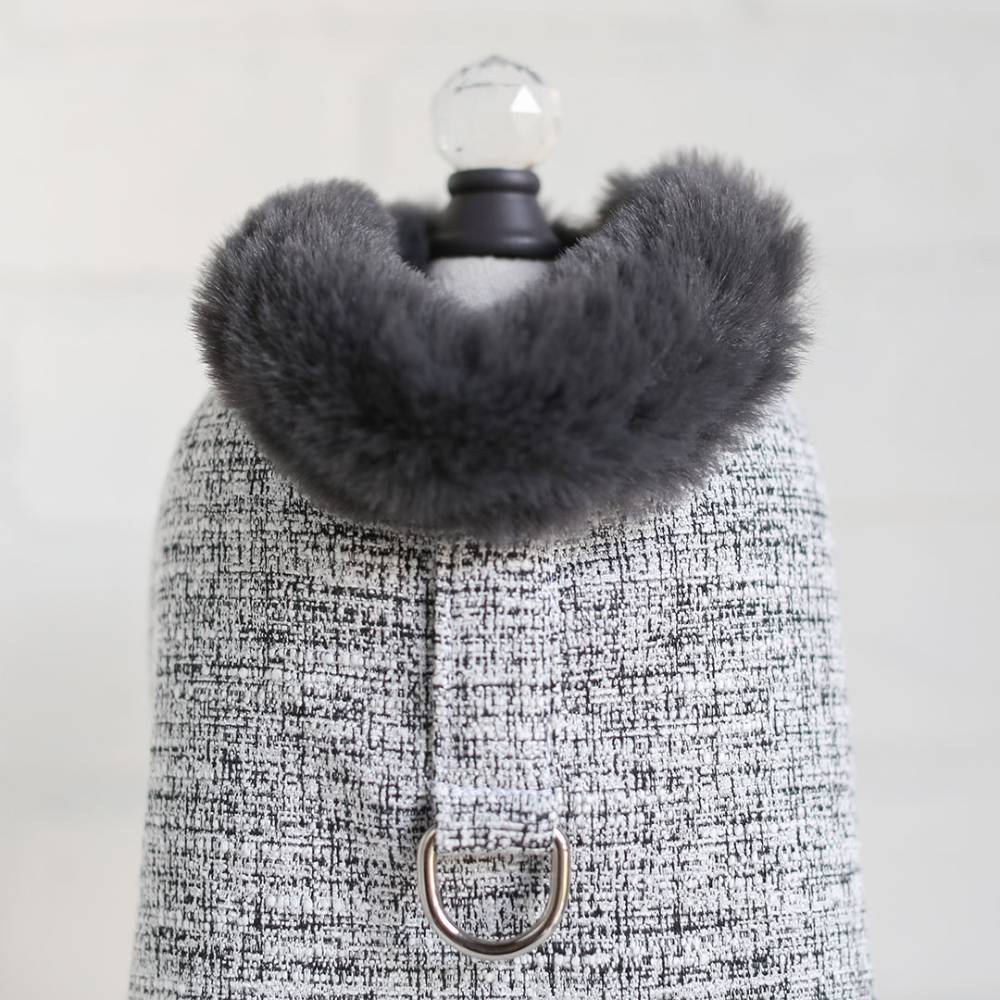 The image shows a close-up of the Hello Doggie Zha Zha Dog Coat in alloy gray with a soft, fluffy collar and a D-ring for leash attachment