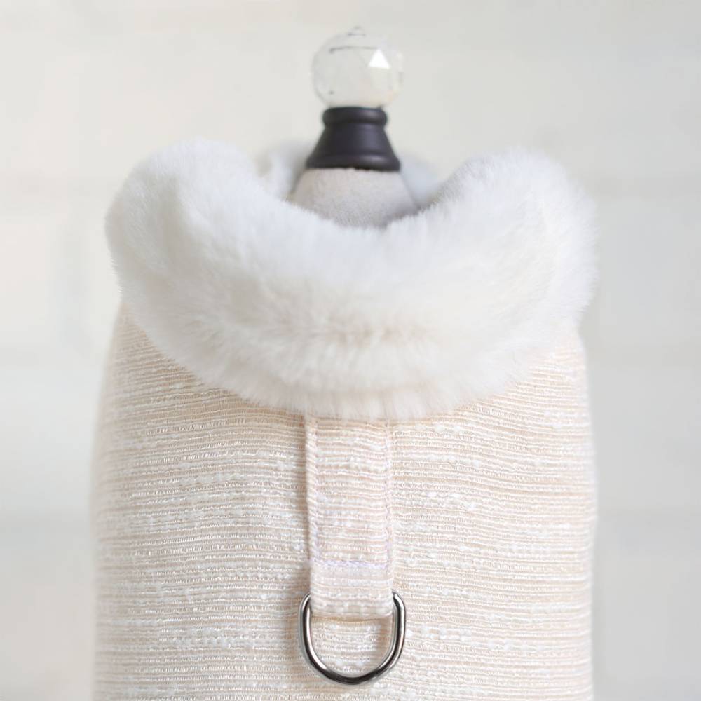 The image shows a close-up of the Hello Doggie Zha Zha Dog Coat in peach with a soft, fluffy collar and a D-ring for leash attachment