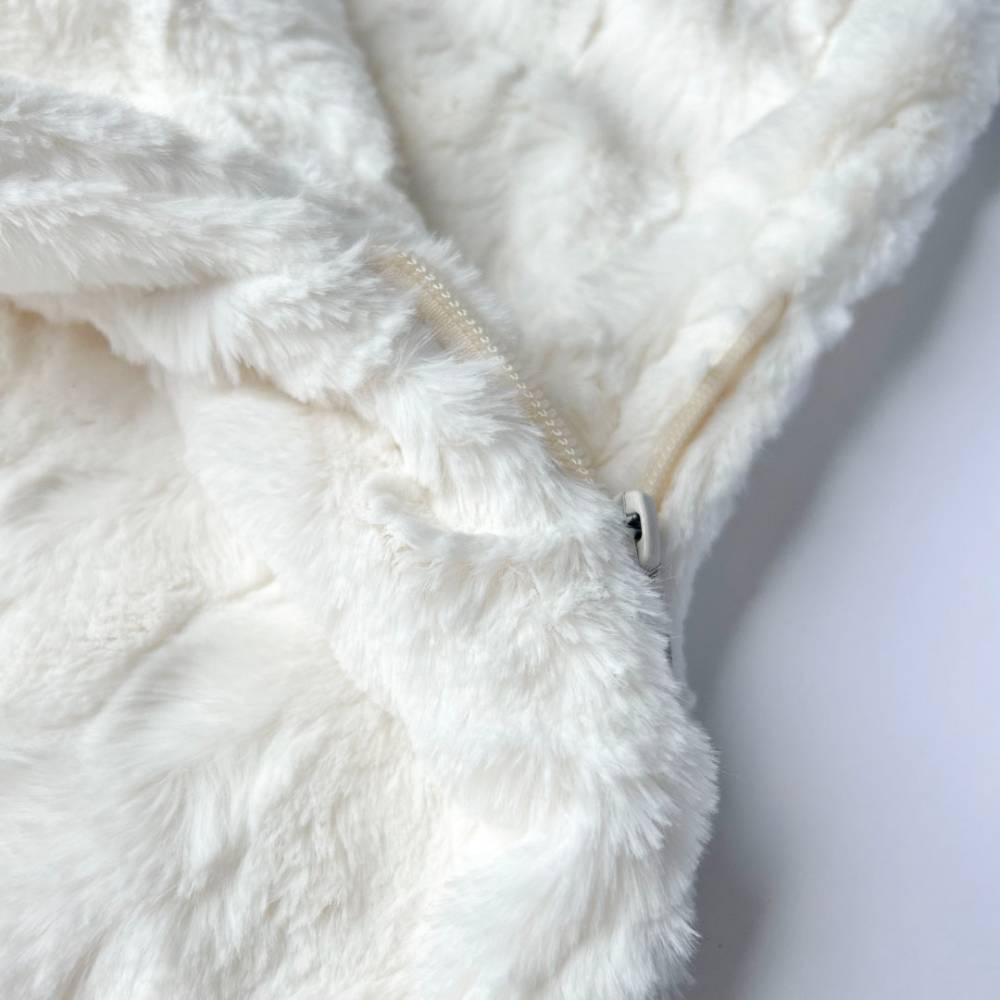 The image shows a close-up view of the Hello Doggie Bella Pup Sleeping Bag in ivory with a visible zipper