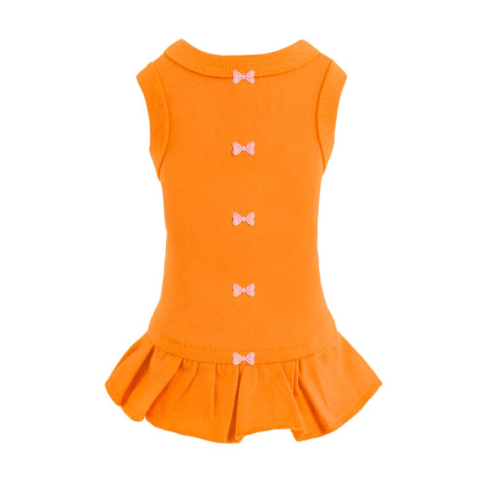 The image shows an orange Hello Doggie Candy Dog Dress with small decorative bows down the back and a ruffled hem