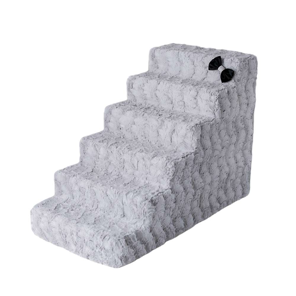 The image shows a set of ivory, four-step Hello Doggie Luxury Pet Stairs with a bow decoration on the side