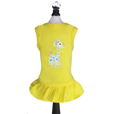 The image shows a yellow Hello Doggie Baby Safari Dog Dress with a cute embroidered giraffe design on the back, displayed on a mannequin