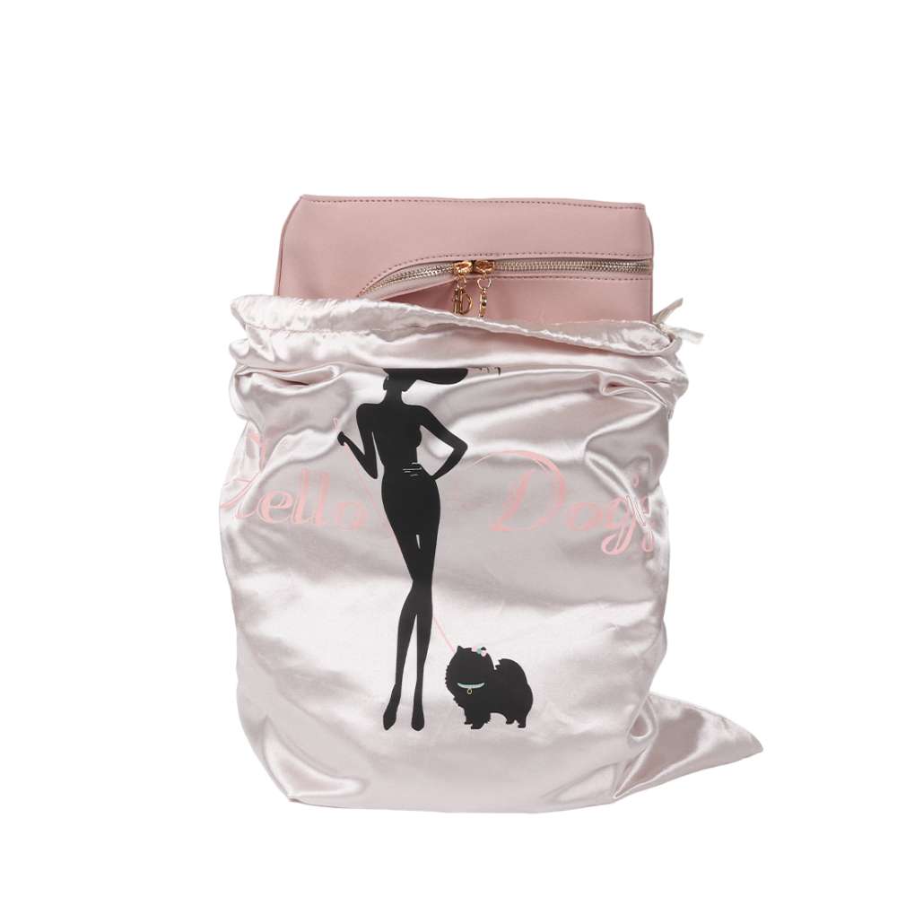 The image shows the Hello Doggie Grand Voyager Dog Carrier in blush color partially enclosed in a branded dust bag