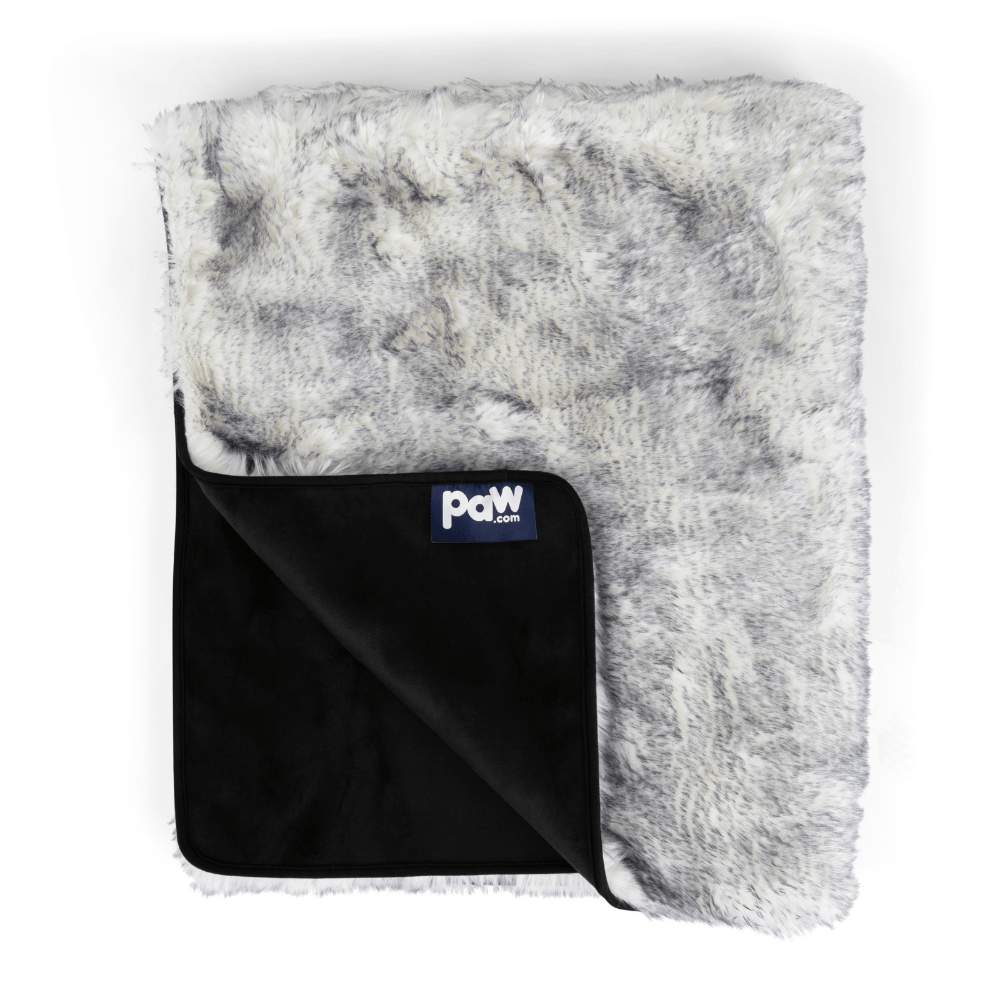 The image shows the Paw PupProtector™ Waterproof Throw Blanket - Ultra Plush Arctic Fox with a folded corner revealing its black underside