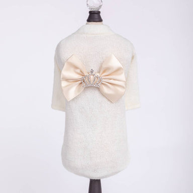 The image shows the back of a Hello Doggie Royal Princess Dog Sweater in cream color, featuring a large satin bow with a rhinestone crown in the center