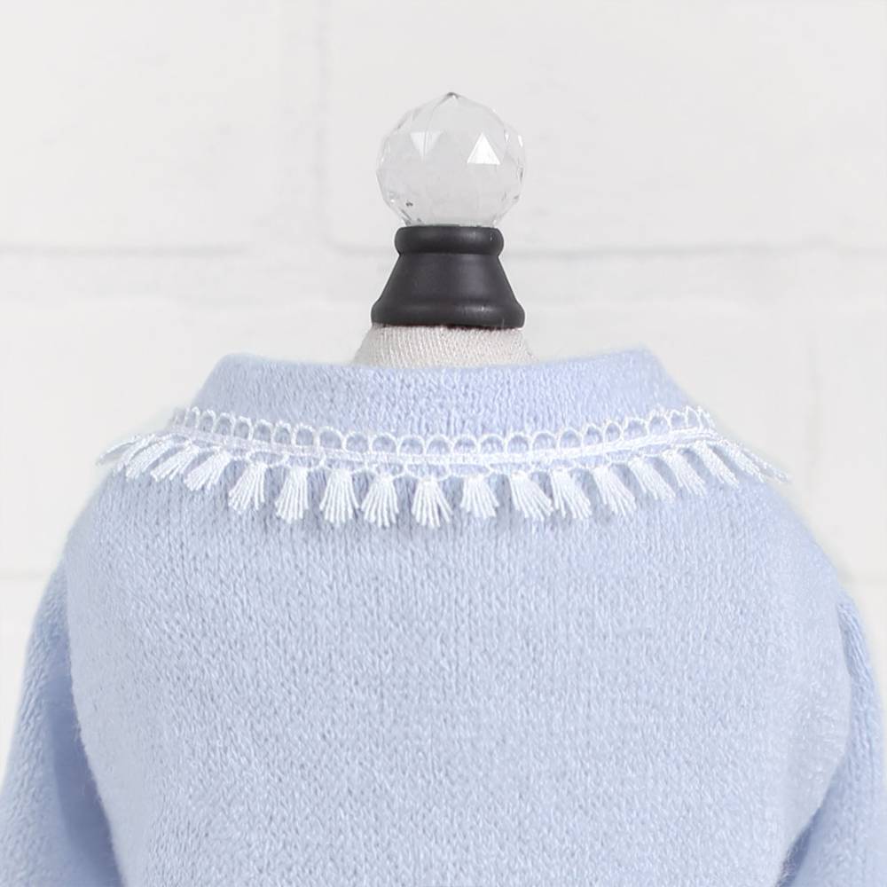 The image shows the back of a blue sweater with a decorative tassel fringe around the neckline, labeled as Hello Doggie Heavenly Kiss Dog Sweater