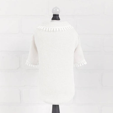 The image shows the back view of a cream sweater with a decorative tassel fringe around the neckline and sleeves, labeled as Hello Doggie Heavenly Kiss Dog Sweater