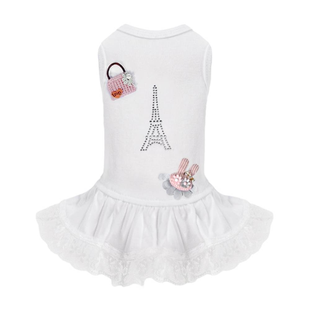 The image shows the back view of a white Hello Doggie Paris Dog Dress, displaying the rhinestone Eiffel Tower design and detailed appliques of a pink handbag and a bunny