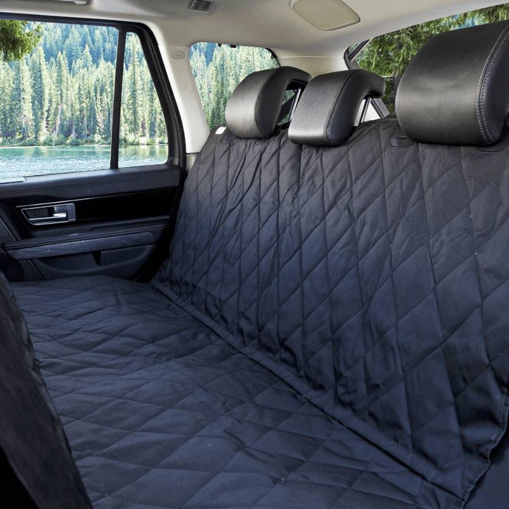 The interior of a car with the Paw PupProtector™ Back Seat Dog Car Cover installed, providing a quilted, protective layer over the back seat