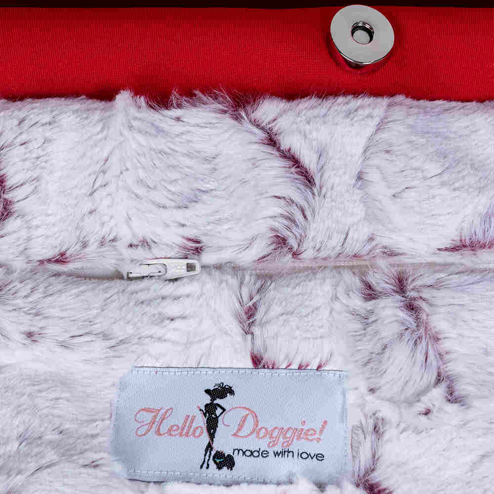 The interior of the Hello Doggie Signature Sling Dog Carrier features plush, white, and red-tinted faux fur for added comfort and a snap closure for security
