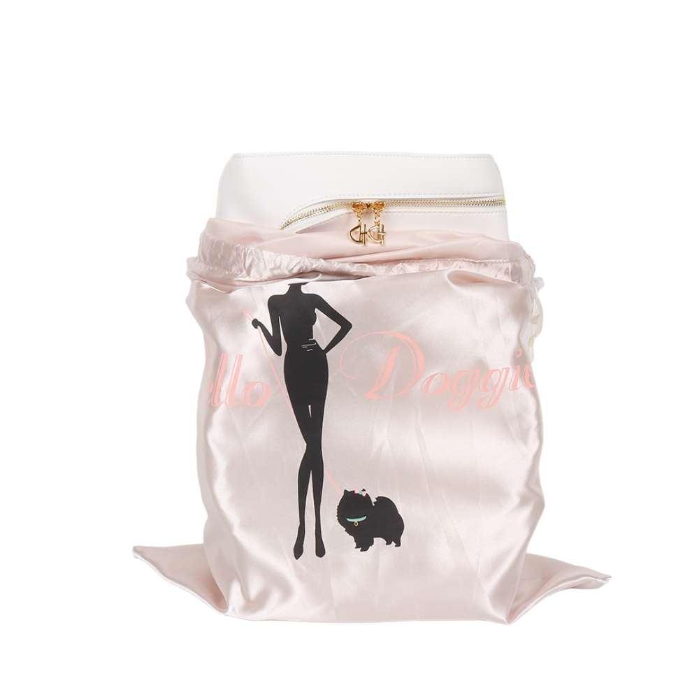The white Hello Doggie Grand Voyager Dog Carrier is displayed in a branded dust bag, emphasizing its luxurious packaging