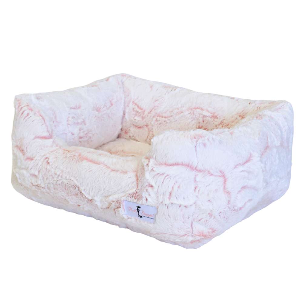 This image showcases the Hello Doggie Whisper Dog Bed in a soft peach shade