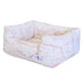 This image showcases the Hello Doggie Whisper Dog Bed in a soft peach shade