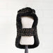 This photo shows the back view of the black tweed dog coat, featuring a soft inner lining and a secure strap, known as the Hello Doggie Chantel Tweed Dog Coat