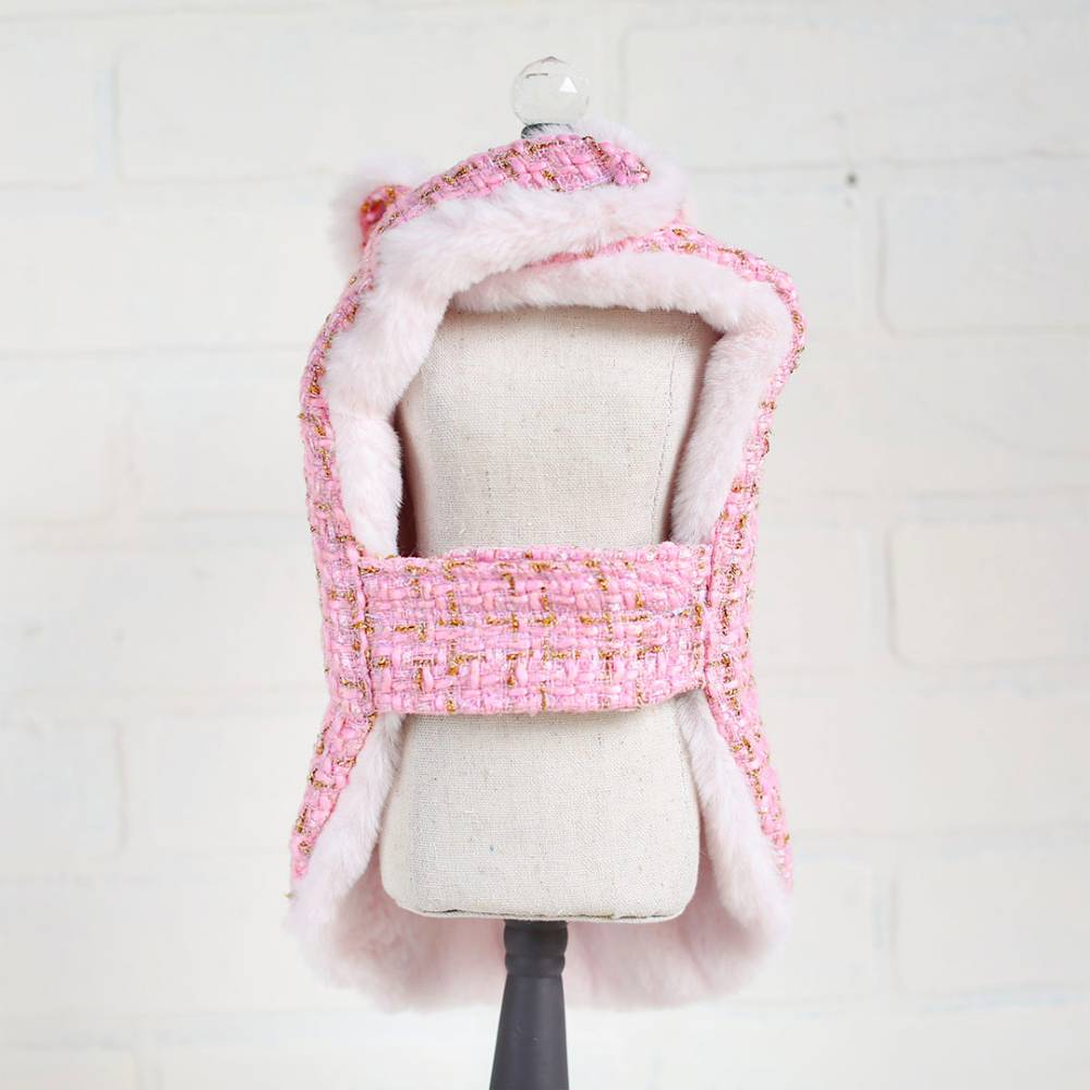 This picture showcases the back view of the bubblegum pink tweed dog coat, highlighting its plush lining and detailed craftsmanship, known as the Hello Doggie Chantel Tweed Dog Coat
