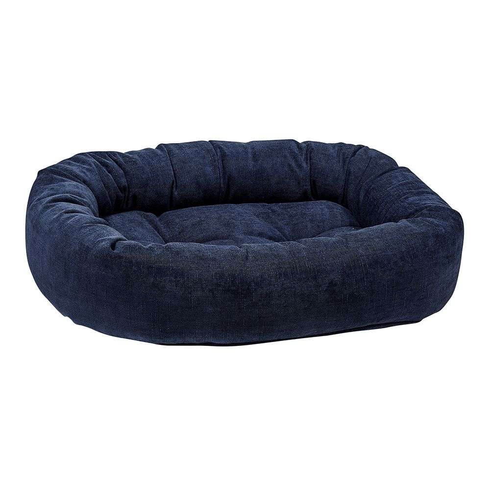 True Navy Bowsers Donut Dog Bed - Platinum Collection shown as a deep navy cushioned donut dog bed with raised sides and a soft padded center