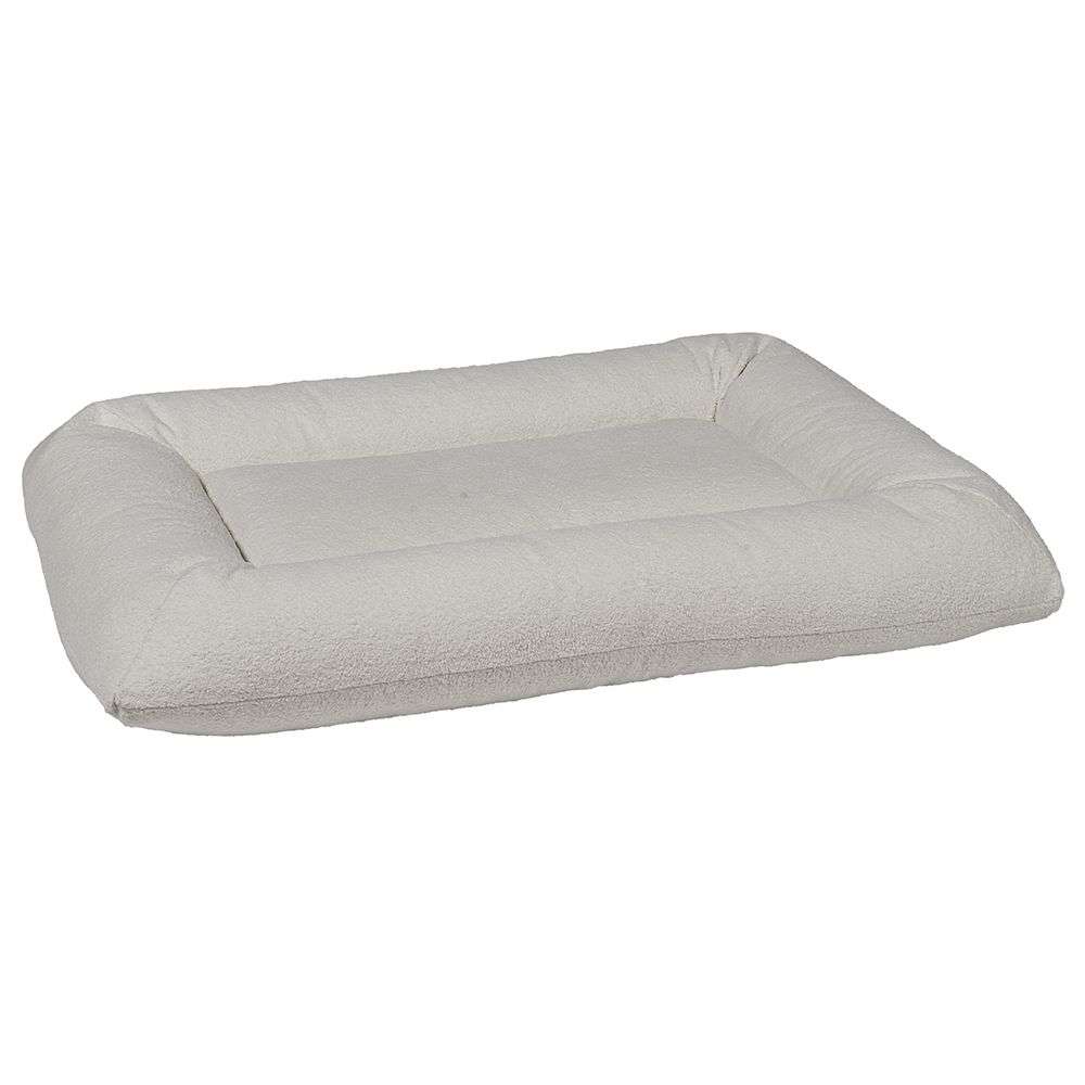 Vanilla Bowsers Hugo Futon Dog Bed features a light cream fabric with a cozy rectangular shape and raised cushioned sides