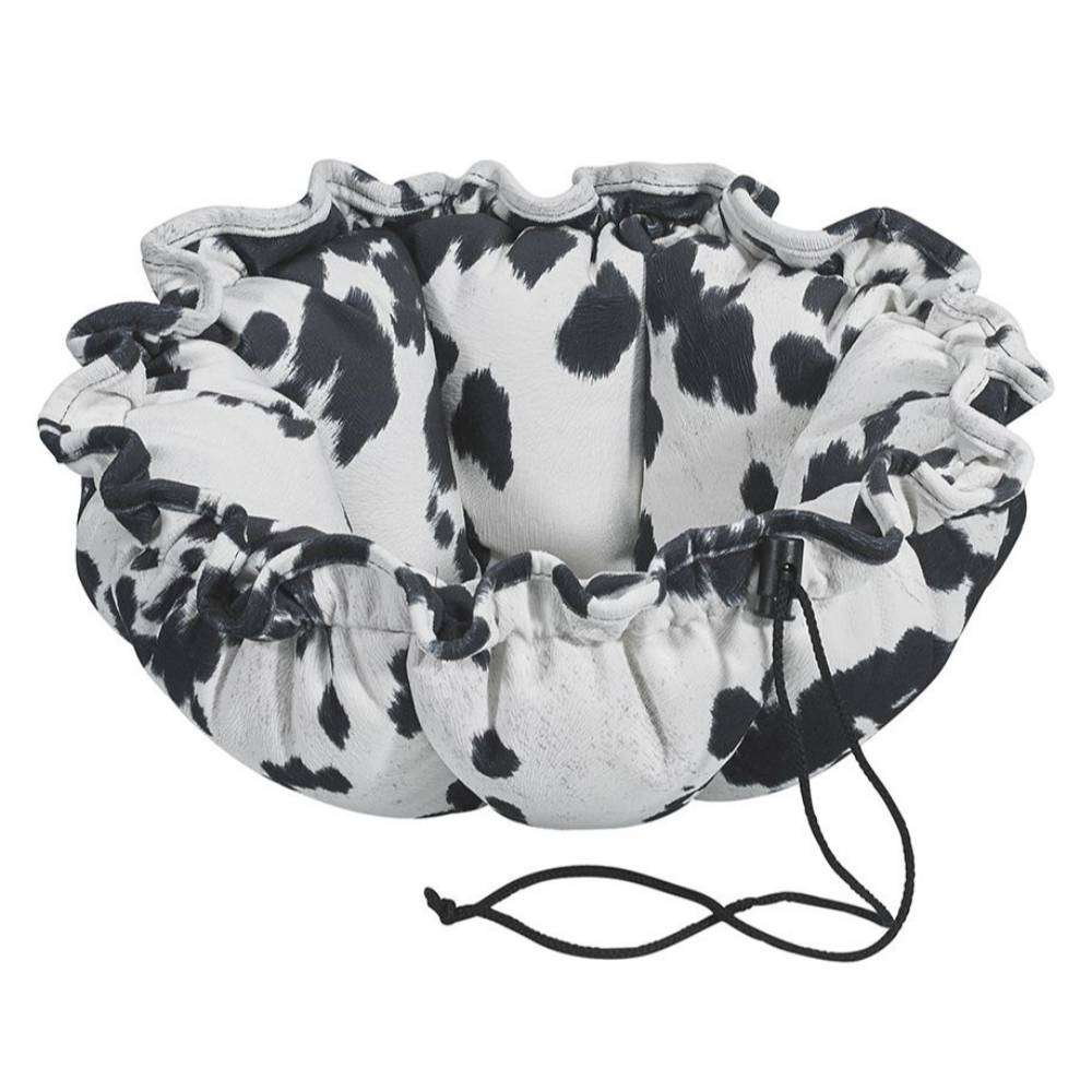 Wrangler Bowsers Buttercup Dog Bed featuring a black and white cow-print design with cozy raised bolsters and drawstring edges