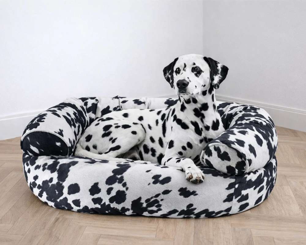 Wrangler Bowsers Double Donut Bed with black-and-white spotted fabric and soft raised sides for cozy relaxation