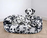 Wrangler Bowsers Double Donut Bed with black-and-white spotted fabric and soft raised sides for cozy relaxation